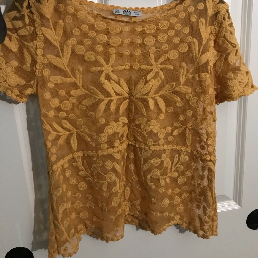 Orange, see-through top